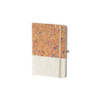 ustom branded A5 cork notebook with colourful speckled cork cover and cotton linen base, sustainable bulk stationery Australia by Wumble Merch