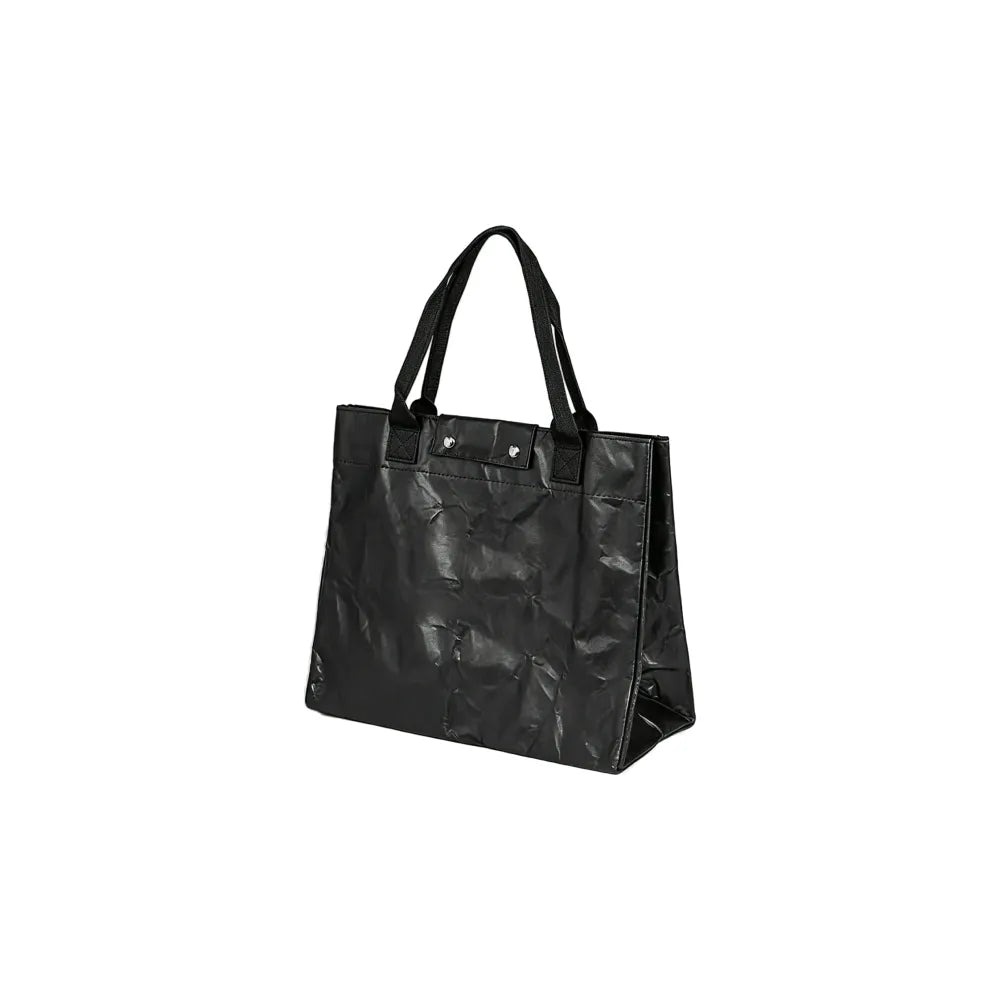Close up of metal press stud closure and Tyvek paper texture on work bag, eco corporate gift Australia by Wumble Merch
